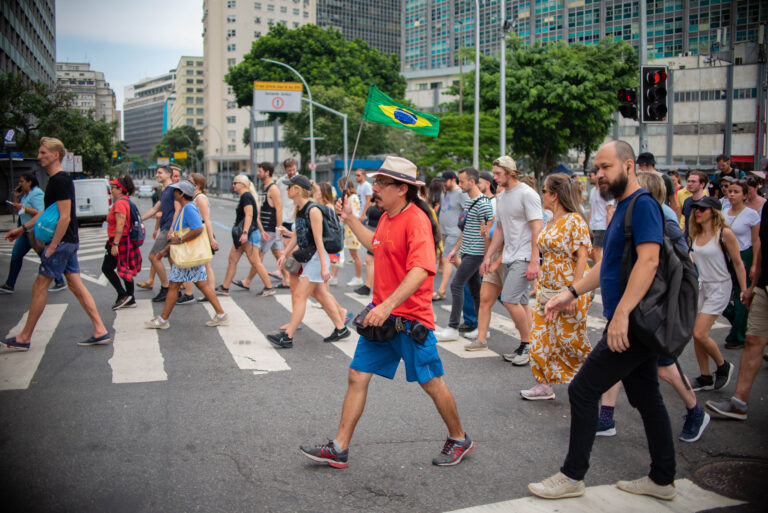 Guide crossing the street with the group